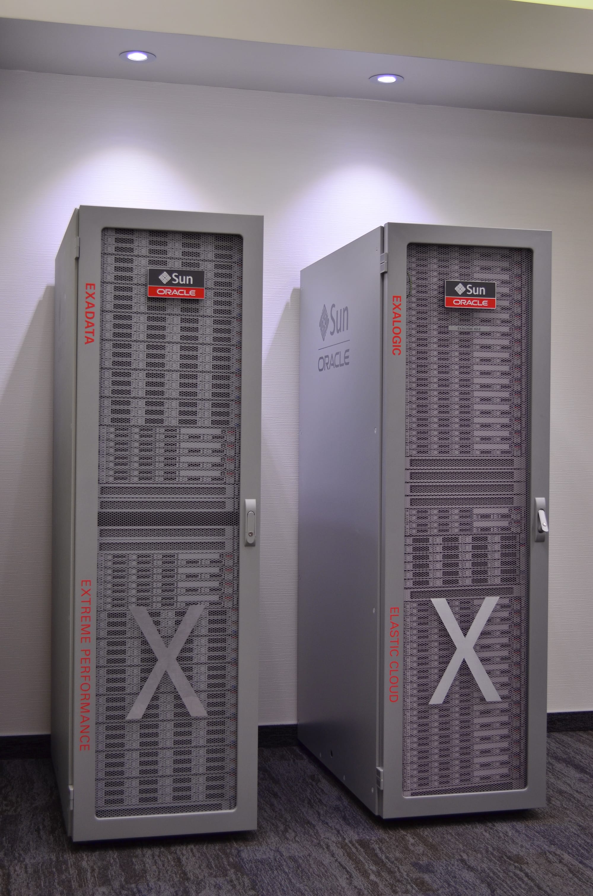 Two beige-grey server racks by Sun Microsystems an Oracle.
